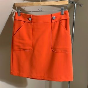 Orange mod skirt with button detail